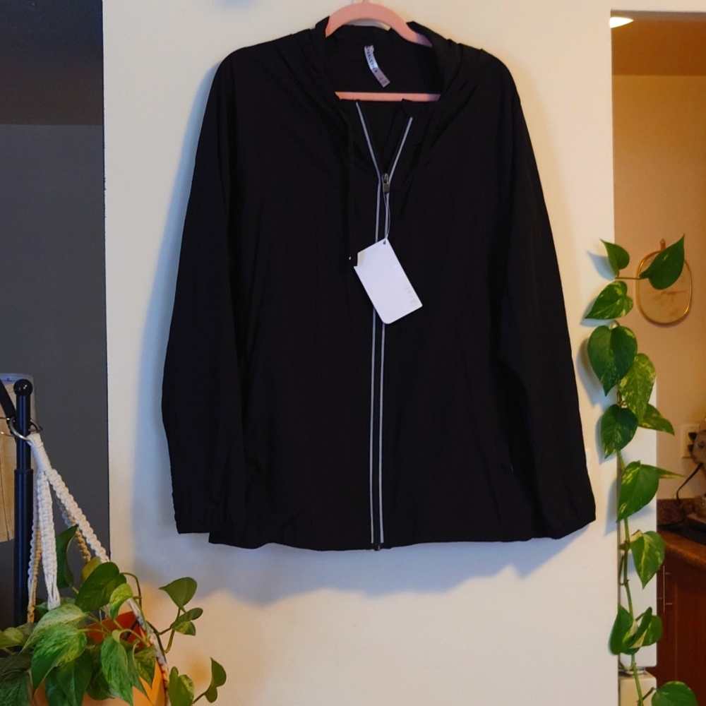 Zip up jacket with hood and zip pockets